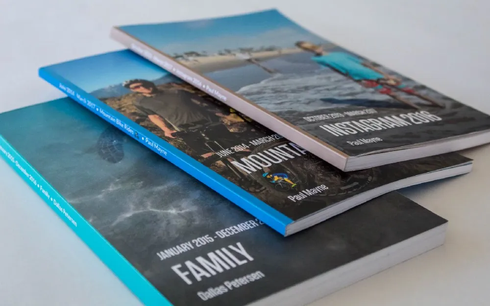 Day One Journaling App Review: Printed bound books created from Day One journal entries, showcasing the app's physical book feature.